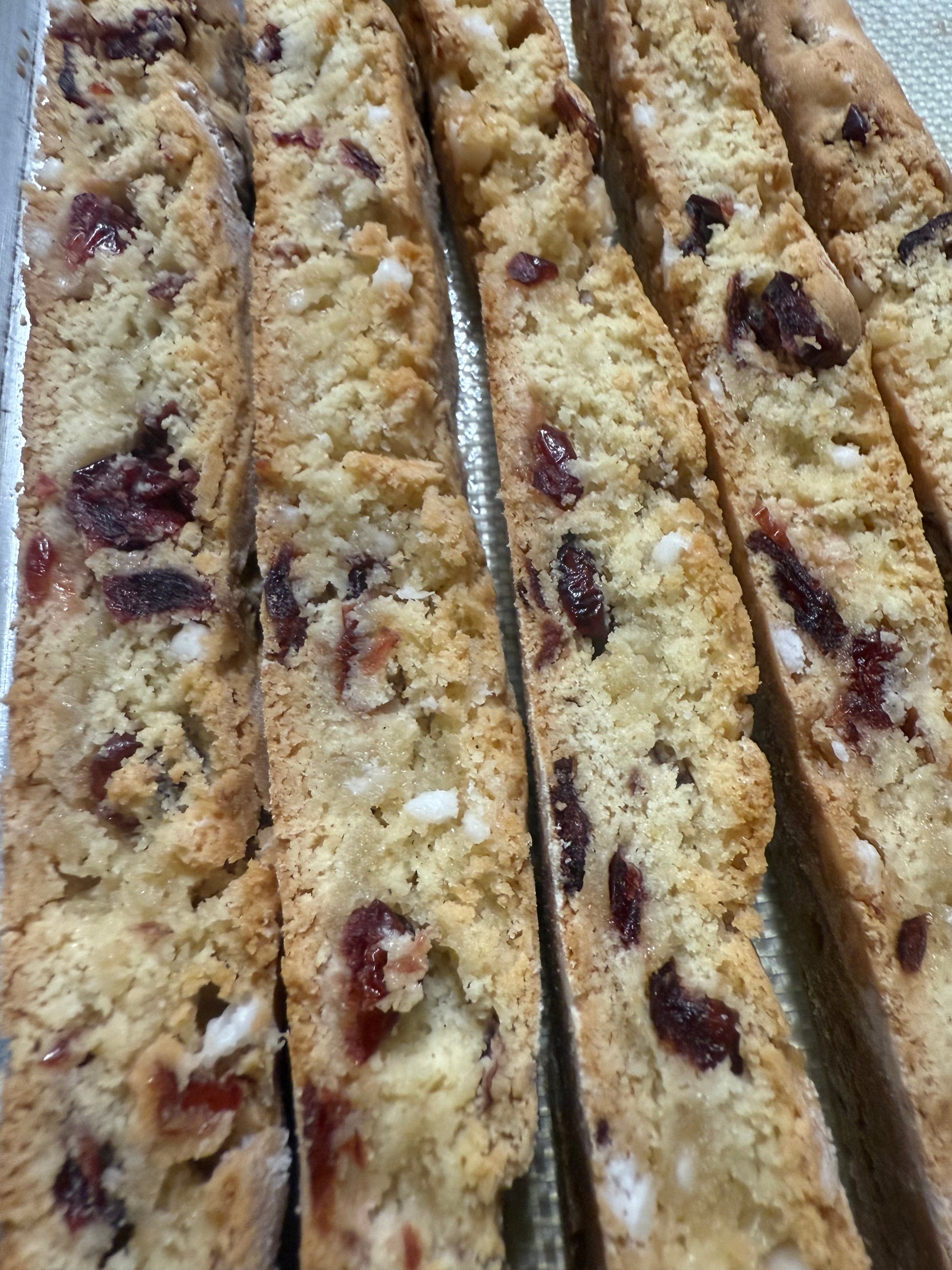 Biscotti cookies with dried fruits on a white surface